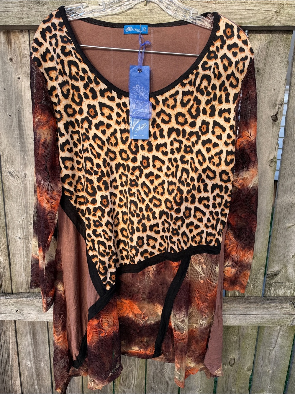 Mixed print long sleeve tunic. Unique pullover top. Very cute!